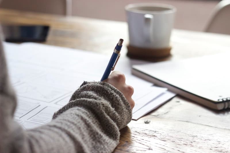Business owner reviewing loan terms and financial documents